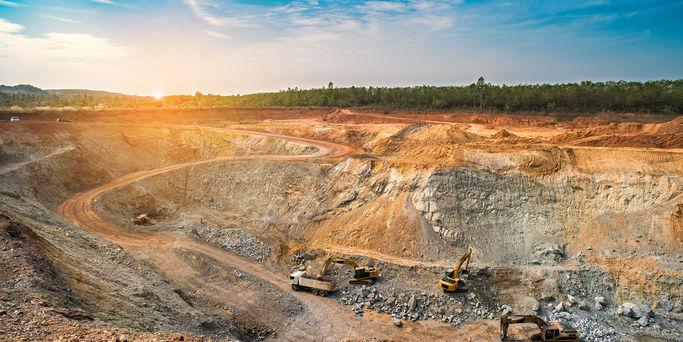 Opencast mining quarry with machinery at work